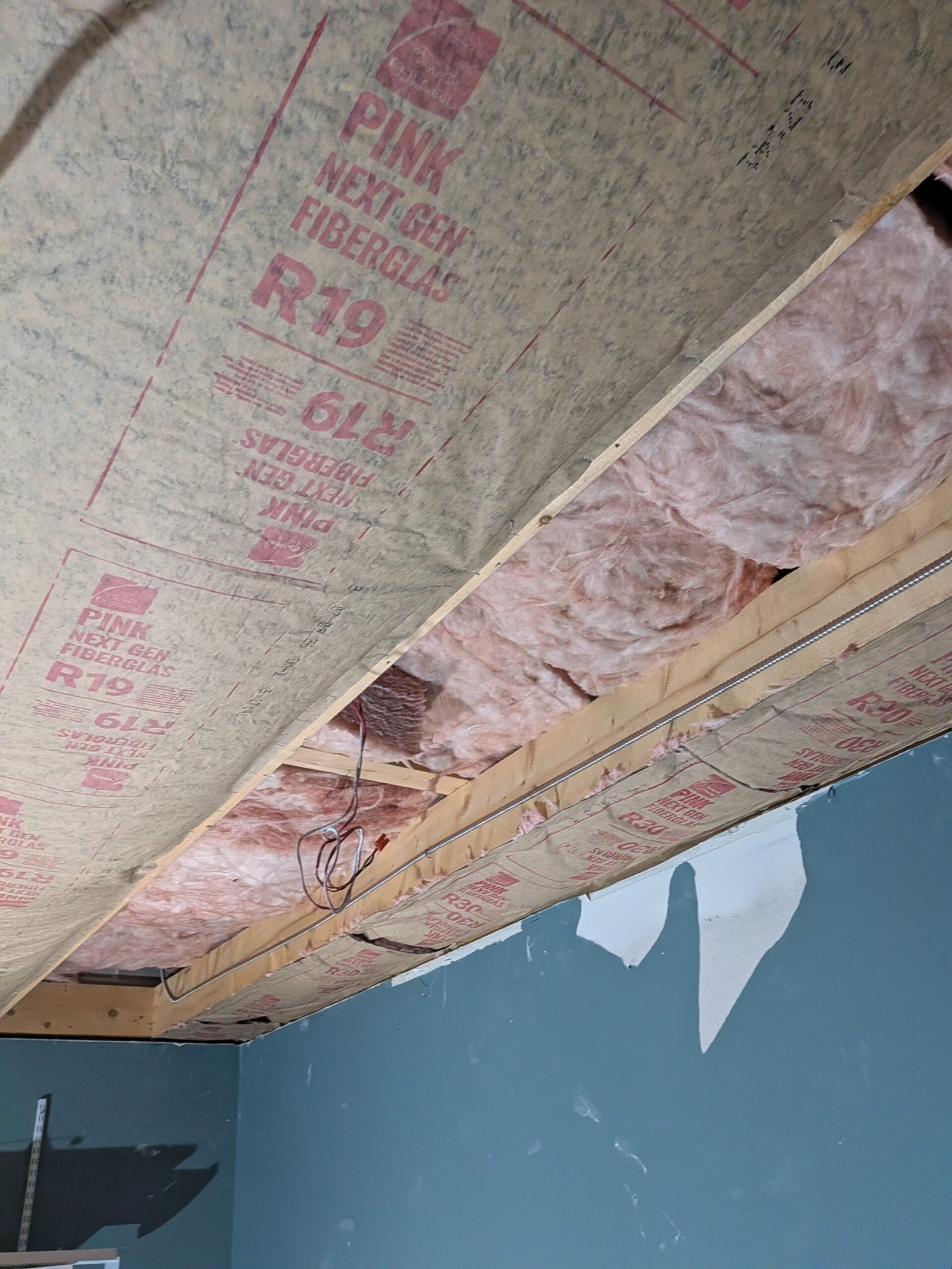 R-49 double layer R-19 and R-30 fiberglass ceiling insulation installation in Massachusetts