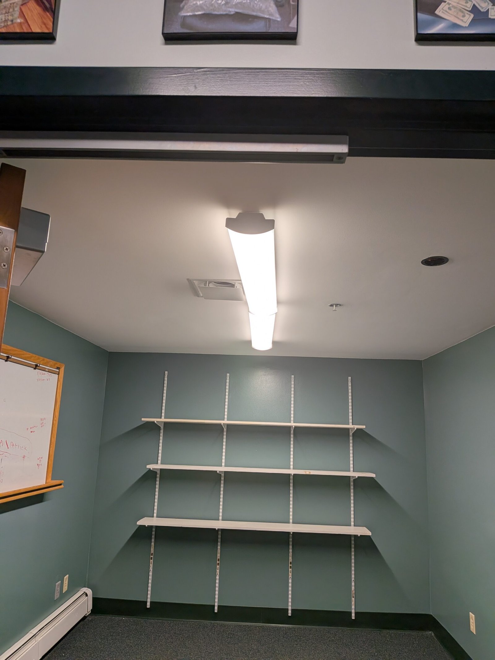 Completed office repair with restored shelving and matched paint, Lancaster Massachusetts